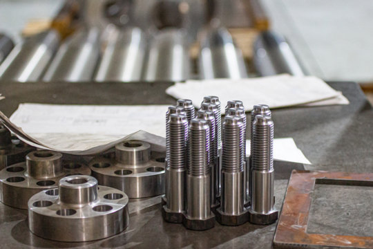 Steel bolts made of steel are made on a lathe.