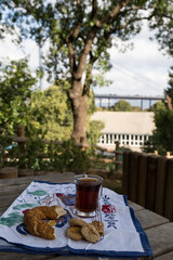 a glass of tea on the wooden background.