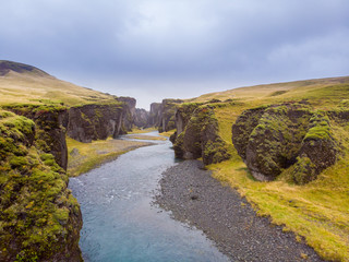 Unique landscape of Fjadrargljufur in Iceland. Top tourism destination. Fjadrargljufur Canyon is a massive canyon about 100 meters deep and about 2 kilometers long, located in South East of Iceland..