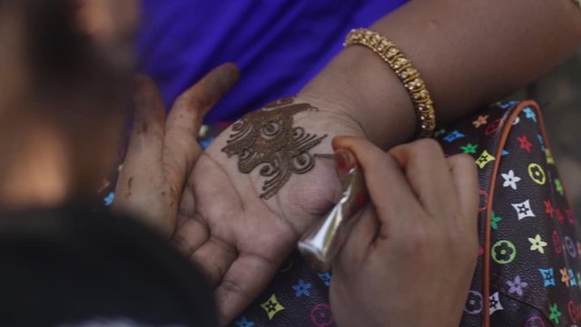 Henna applied on the bride hand 