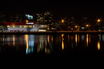 night city with lanterns and reflection in water