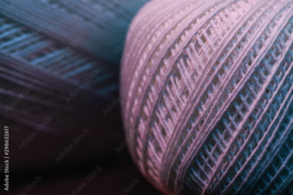 Poster close up beautiful tangle of thread in red and blue light on a dark background. macro photography vi