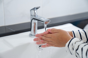 Women wash hands in washbasins, wash,basinswater,water and basin,basin	                    