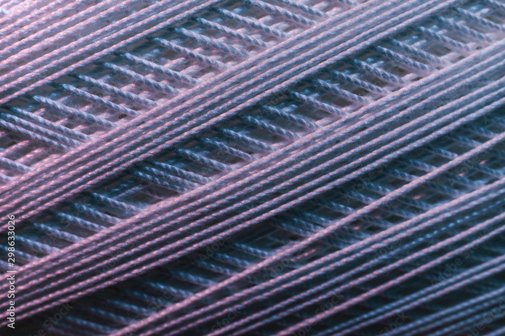 Poster Close up beautiful tangle of thread in red and blue light background texture. Macro Photography view.