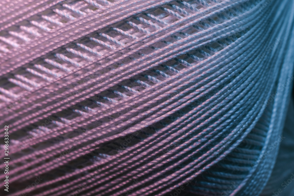 Poster close up beautiful tangle of thread in red and blue light background texture. macro photography view