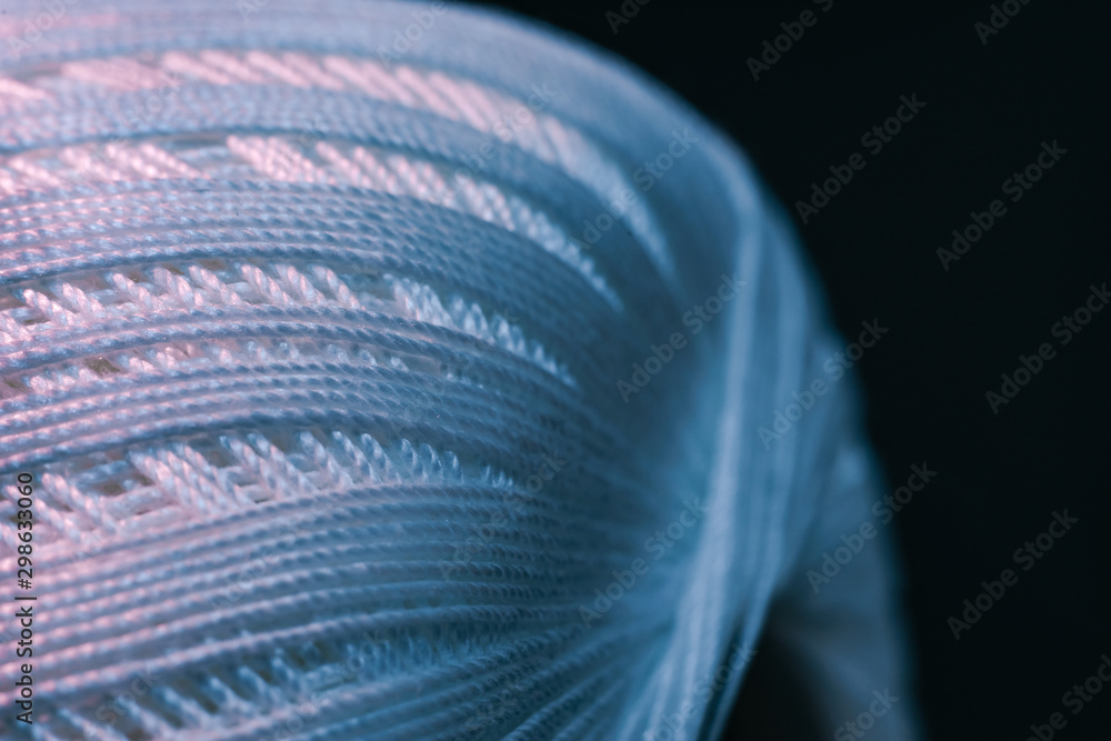 Poster close up beautiful tangle of thread in red and blue light background texture. macro photography view