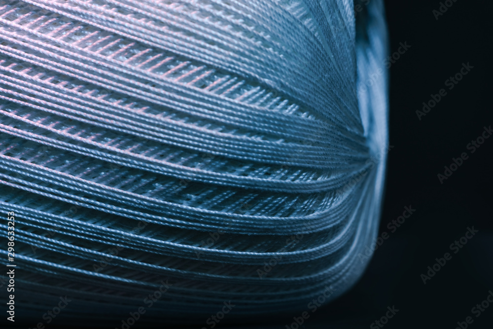 Poster Close up beautiful tangle of thread in red and blue light background texture. Macro Photography view.