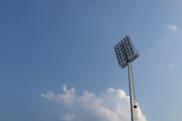 Sport light on the white clouds background,
