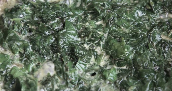 Сooking spinach in frying pan
