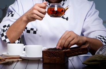 The tea expert brewing cup of drink