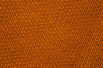 Close-up of an orange knitted fabric