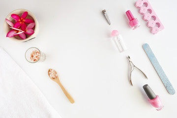 Tools of manicure set for nail care on a white background with a pink color. Beauty concept. Copyspace mockup.