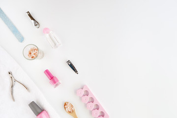 Tools of manicure set for nail care on a white background with a pink color. Beauty concept. Copyspace mockup.