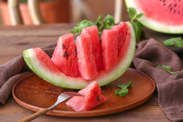 Ripe cut watermelon on table