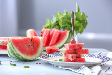 Ripe cut watermelon on table
