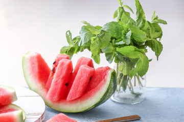 Ripe cut watermelon on table
