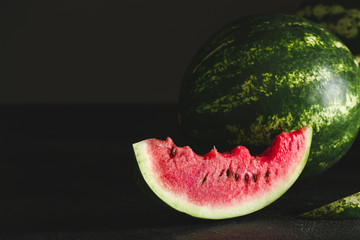 Sweet ripe watermelon on dark background