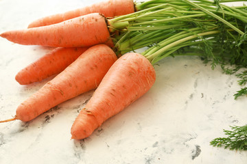 Fresh carrots on light background