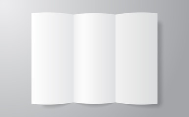 Blank trifold paper brochure mockup on soft gray background with soft shadows.