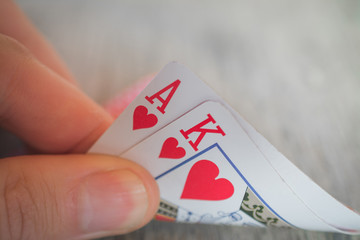 Playing cards in hand on the table, poker nands