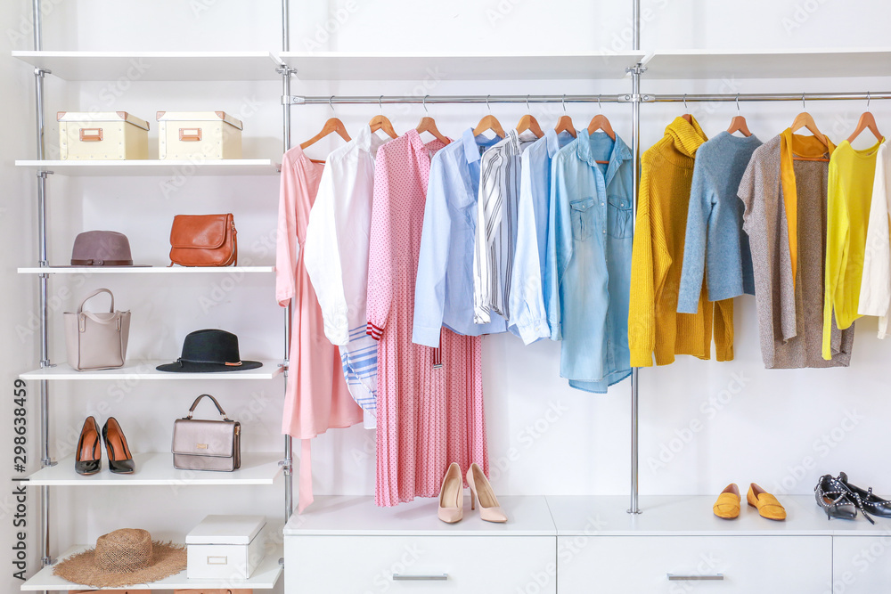 Wall mural Big wardrobe with clothes in dressing room