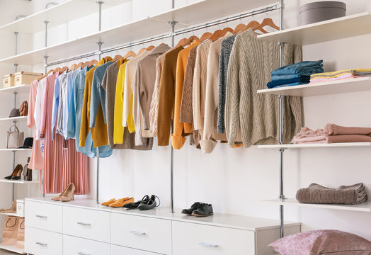 Big Wardrobe With Clothes In Dressing Room