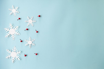 Blue background with snow flakes.Winter and Christmas concept.top view and copy space for text.