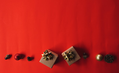 Christmas composition. Christmas red decorations on red background. Flat lay, top view, copy space.