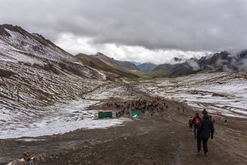 Tourists are going to the Rainbow Mountain (Peru)