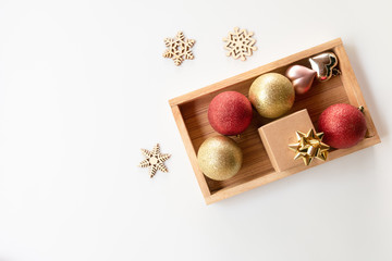 Christmas composition. Christmas balls and snoe flakes, red decorations on white background. Christmas, winter, new year concept. Flat lay, top view, copy space.