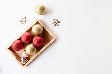 Christmas composition. Christmas balls and snoe flakes, red decorations on white background. Christmas, winter, new year concept. Flat lay, top view, copy space.
