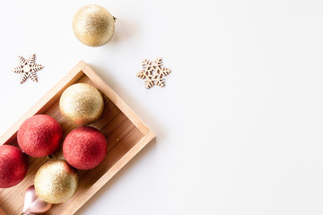 Christmas composition. Christmas balls and snoe flakes, red decorations on white background. Christmas, winter, new year concept. Flat lay, top view, copy space.