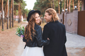 Happy couple celebrating their wedding outdoors