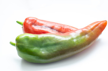 chillies in the foreground on a white background