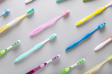 Set of tooth brushes on light background