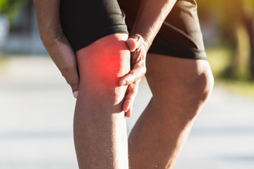 Man walking on the road get accident for her knee the image is for health concept.