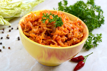 Braised cabbage from tomato sauce on a table. Lenten menu. Diet low-calorie vegetable dish.