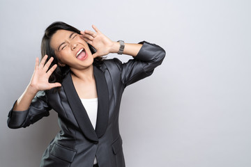 Happy woman making shout gesture isolated over white background