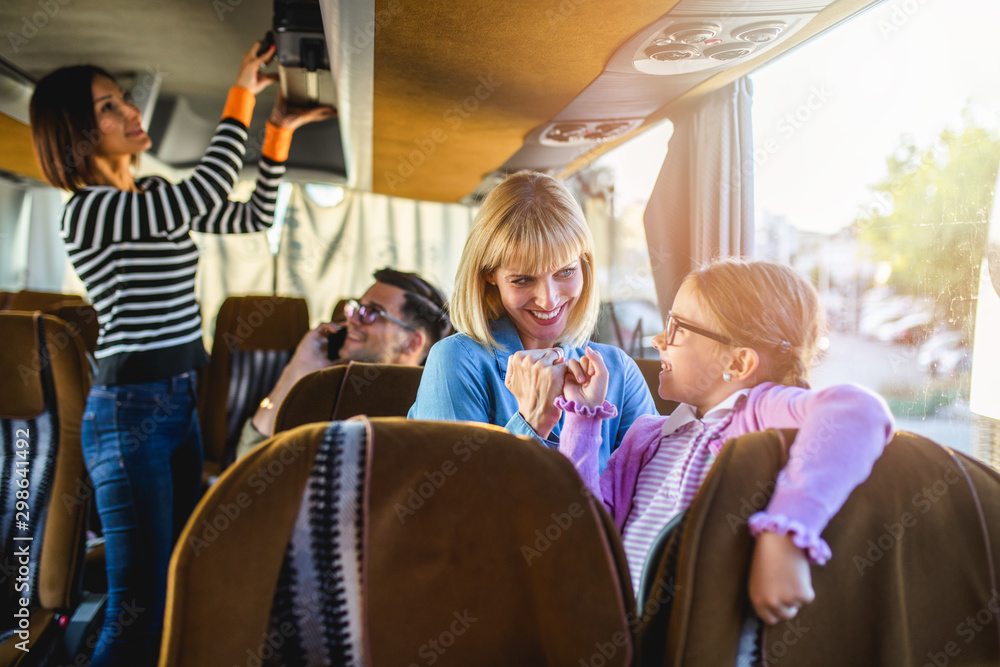 Wall mural Happy passengers traveling by bus.