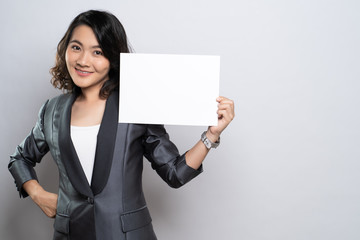 Business woman showing paper isolated over white background