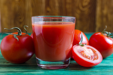 Tomato juice in a transparent bowl and tomatoes are healthy food