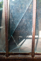 Blurred broken dust Glass door texture background, Rusty metal frame, Close up shot, Selective focus, Reflection, Home decor repair concept