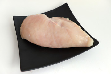  chicken breast on black plate