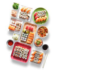 Fototapeta Assortment of trays and plate of sushi and maki obraz