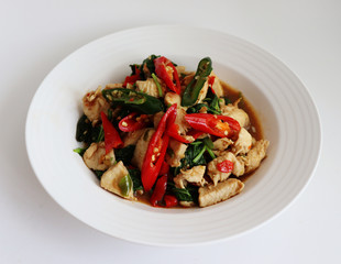 Spicy fried chicken with basil leaves
