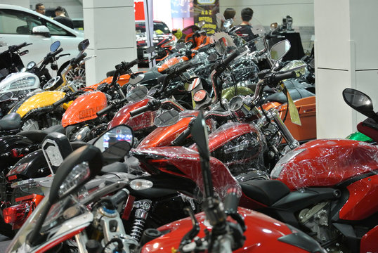 KUALA LUMPUR, MALAYSIA -JUNE 18, 2017: Big bike motorcycle in huge showroom. Some of the motorcycle still in wrapping plastic to protect its body from scratch. 