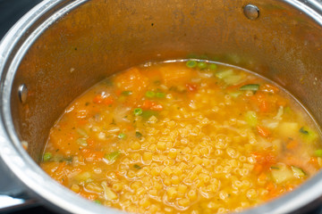 minestrone, soup of fresh vegetables in the foreground