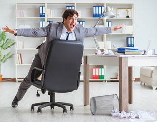 Businessman having fun taking a break in the office at work