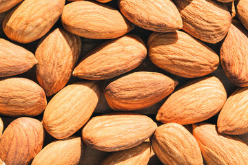 Close up raw peeled almonds seed abstract background and texture.
