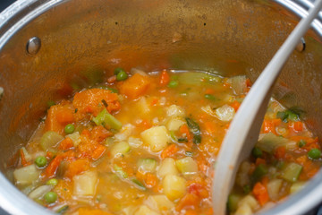 minestrone, soup of fresh vegetables in the foreground